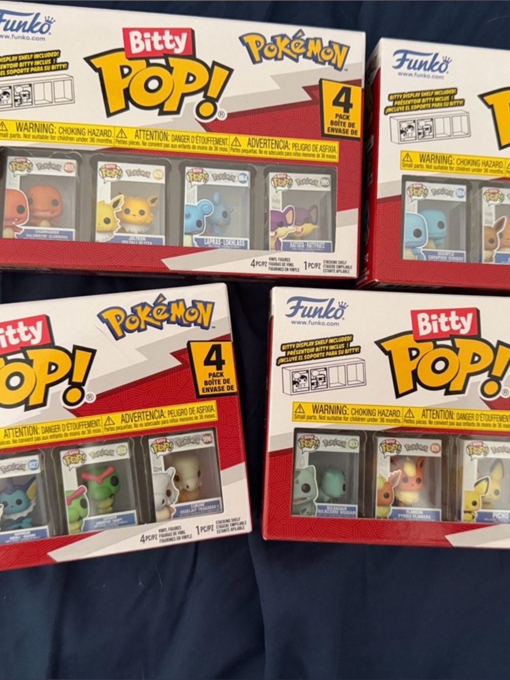 Funko Pokémon Bitty 4-Pack Set – Red, White, Yellow, Blue Accents